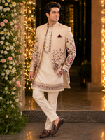 Indo western with kurta and same color trouser attached with a vibrant floral embroidery all over to make the groom or related family person attire most stylish and elegant for the perfect evening look .