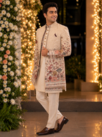 Indo western with kurta and same color trouser attached with a vibrant floral embroidery all over to make the groom or related family person attire most stylish and elegant for the perfect evening look .
