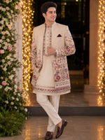 Indo western with kurta and same color trouser attached with a vibrant floral embroidery all over to make the groom or related family person attire most stylish and elegant for the perfect evening look .