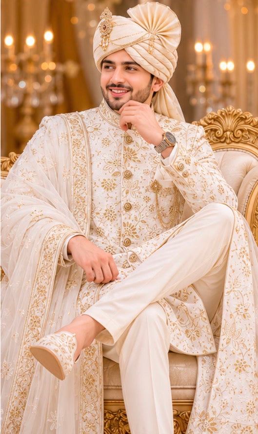 Off white Sherwani with complete jardozi handwork from top to bottom to enrich the groom’s attire on the wedding night with saafa and dupatta wrapped in the most stylish manner with authentic matching broach on the pocket with pocket square .