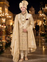 Shreemaan golden silk sherwani with hand jardozi embroidery all over to give the groom a very stylish look with silk safa & dupatta combined with Shewani mala