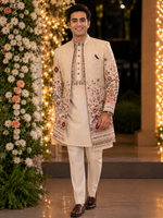 Indo western with kurta and same color trouser attached with a vibrant floral embroidery all over to make the groom or related family person attire most stylish and elegant for the perfect evening look .