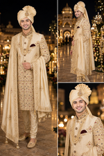 Shreemaan golden silk sherwani with hand jardozi embroidery all over to give the groom a very stylish look with silk safa & dupatta combined with Shewani mala