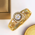 Imperial Golden Anti - Tarnish golden imitation ladies watch with moti ( Pearl ) embossed on the wrist steel gold lackered strap