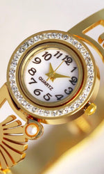 Imperial Golden Anti - Tarnish golden imitation ladies watch with moti ( Pearl ) embossed on the wrist steel gold lackered strap
