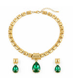 Gold Anti - Tarnish imitation jewellery necklace with earrings having green attractive stone embossed in both tuffs and shiftable necklace pendant