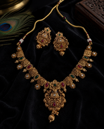 Golden necklace rajwadi sets ( Anti - Tarnish ) with minutely handcrafted meenakaari work of natural red and green color with earrings to embrace any dress or saree you want to wear